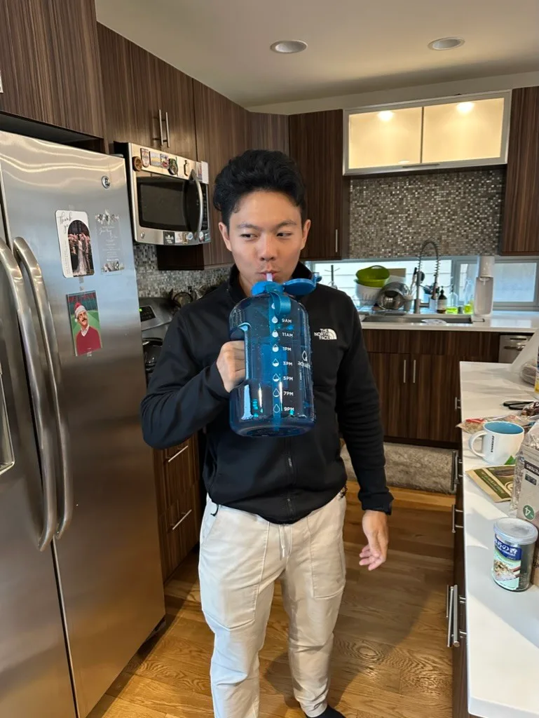 We work together in an apartment. Richard likes to keep himself hydrated.