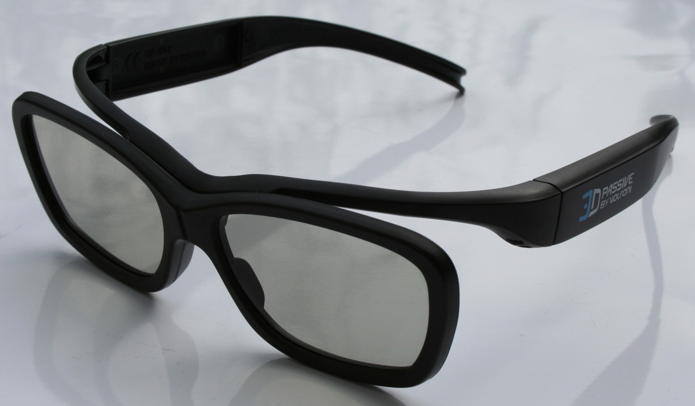 A pair of black plastic passive 3D glasses with grey lenses and the words 3D Passive by Volfoni on the temple.