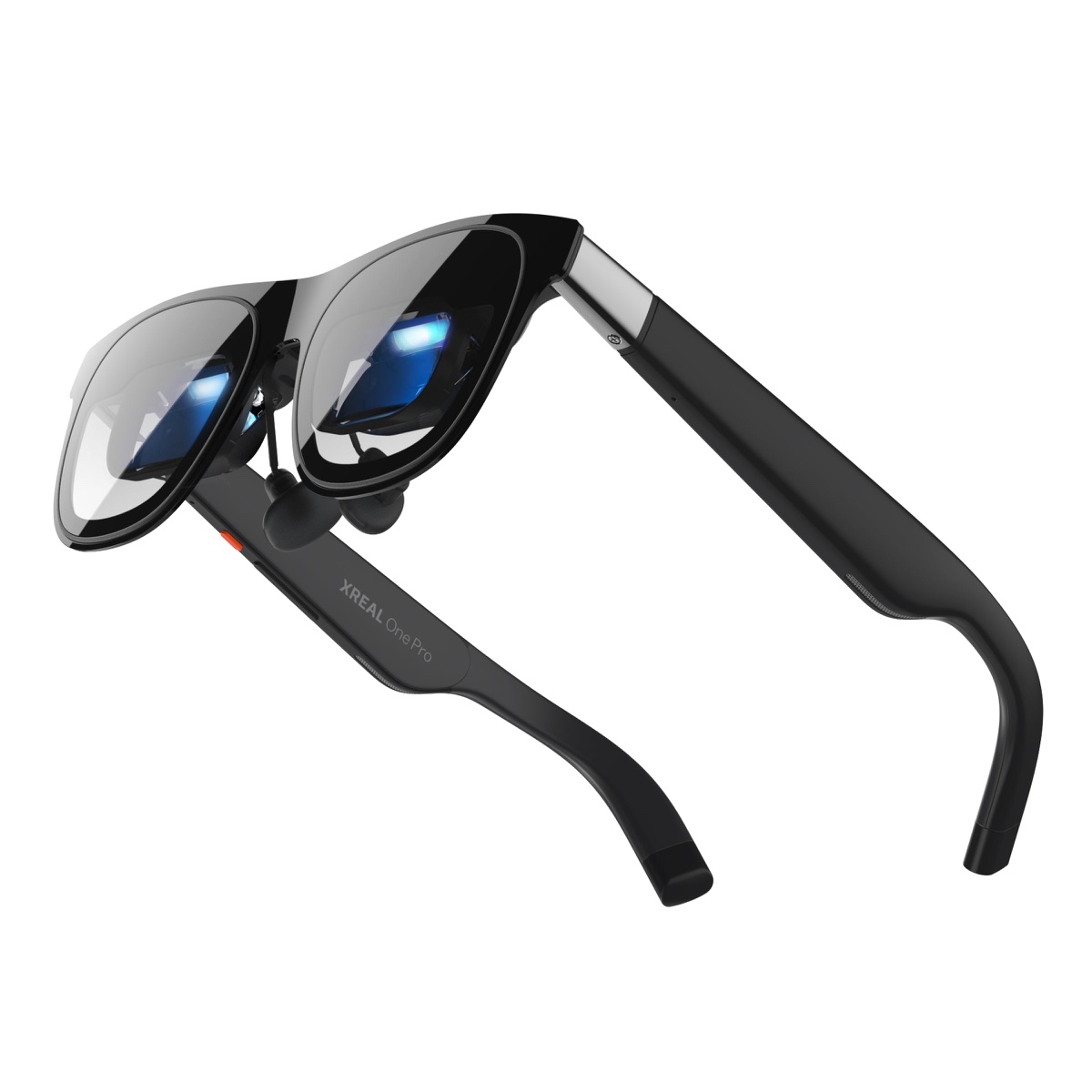 A pair of black XREAL One Pro glasses seen from below and to one side, showing the two small lenses behind the front shade.