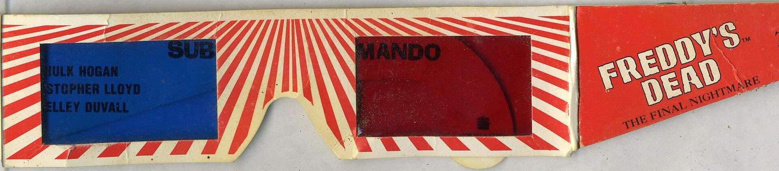 Flattened cardboard 3D glasses with red and white stripes, a blue filter and a red filter, and "Freddy's Dead: The Final Nightmare" printed on one arm.