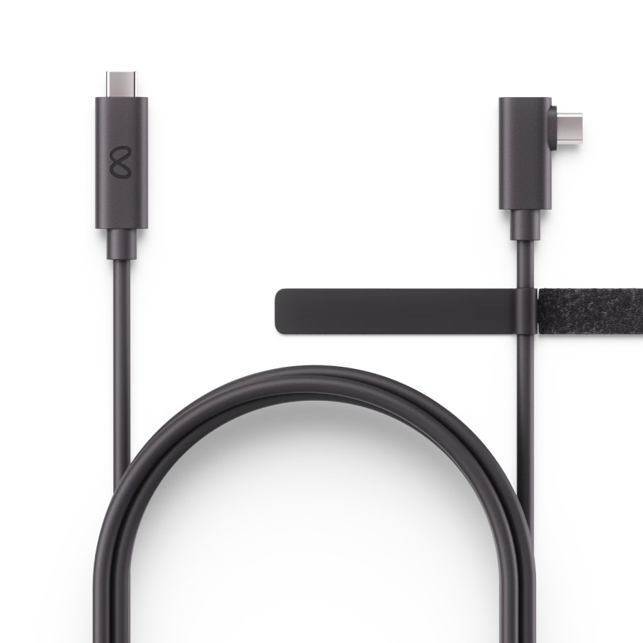 A coiled black USB-C cable with a straight connector on one end and an angled connector on the other.