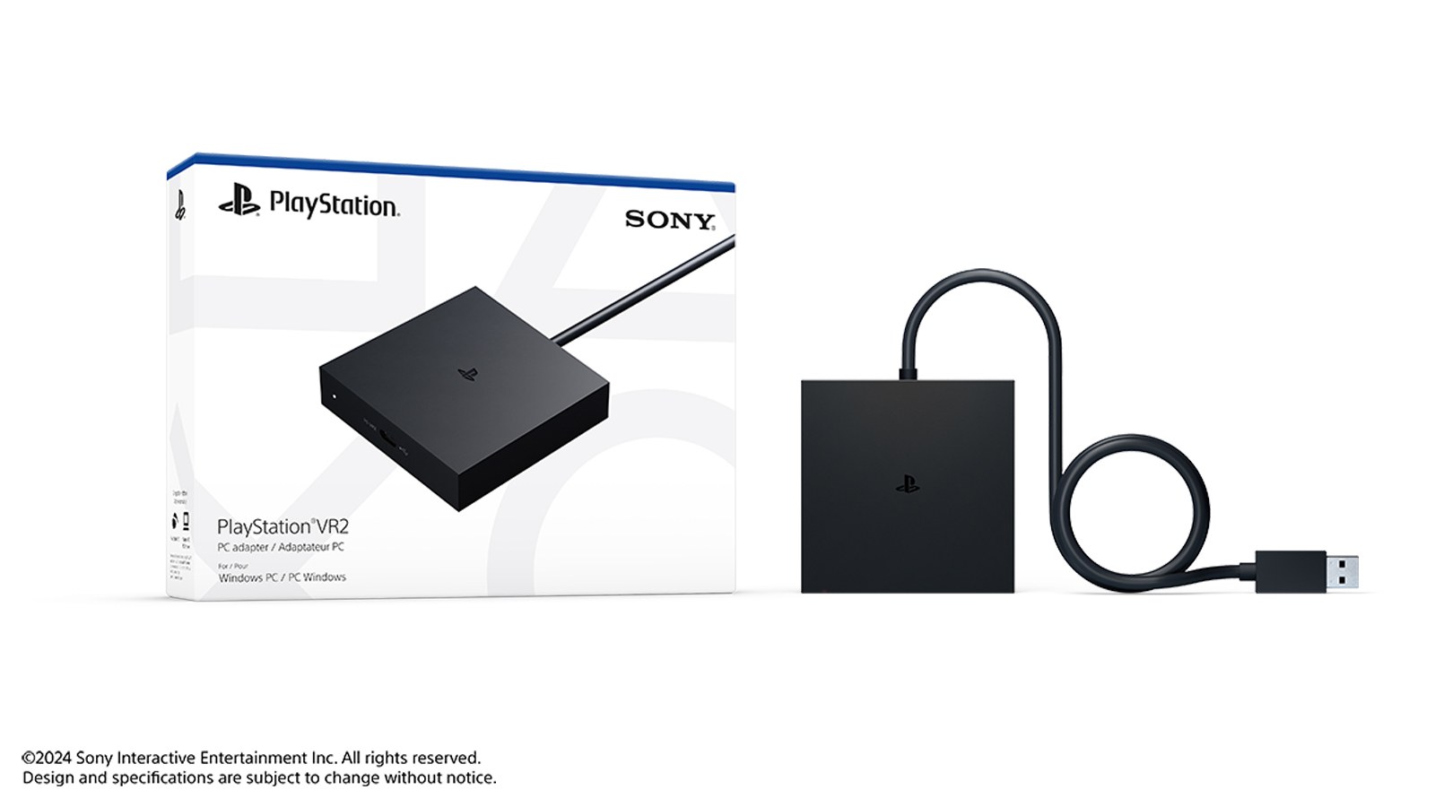 The PlayStation VR2 PC adapter, a small black box with an attached USB cable, next to its retail box.